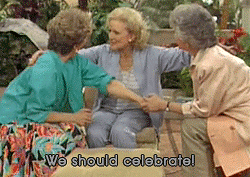 Rose, Blanche and Dorothy from The Golden Girls huddle together with the caption, "We should celebrate."